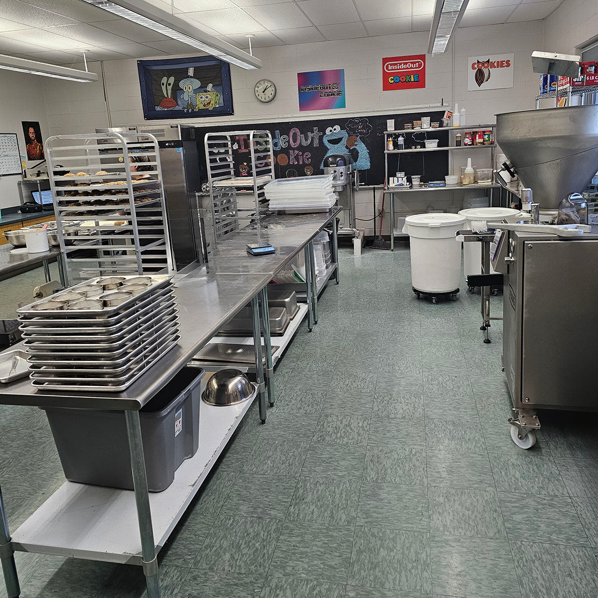 The Inside Out Cookie kitchen, with the name chalked on the board and the mixer ready